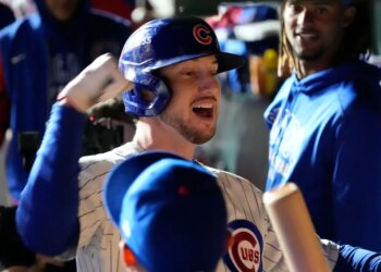 Chicago Cubs right fielder Kyle Tucker (30) reacts in the dugout after hitting a home run.