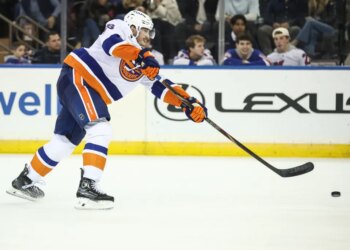 New York Islanders defenseman Alexander Romanov (28) attempts a shot on goal in the second period against the New York Rangers at Madison Square Garden.