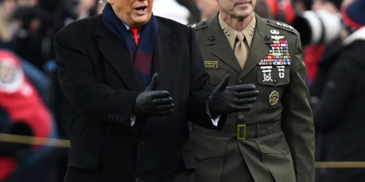 Donald J. Trump and a military officer walking.