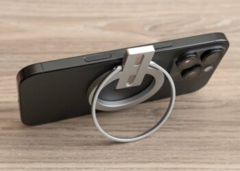 The Abxylute M4’s magnetic mount attached to an iPhone 16 Pro and supporting it like a stand.