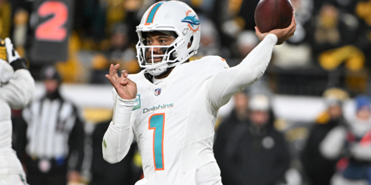 Miami Dolphins quarterback Tua Tagovailoa (1) throws the ball.