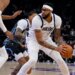 Dallas Mavericks forward Anthony Davis, right, posts up against Utah Jazz guard Keyonte George, center, during the first half of an NBA basketball game, Thursday, Jan. 8, 2026, in Salt Lake City.