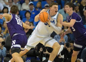 UCLA Bruins forward Tyler Bilodeau (34) drives to the basket as Northwestern Wildcats guards Max Green (10) and Jake West (3) defend.
