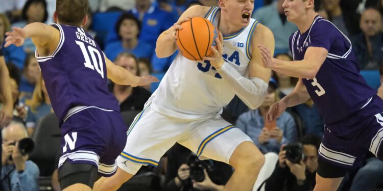 UCLA Bruins forward Tyler Bilodeau (34) drives to the basket as Northwestern Wildcats guards Max Green (10) and Jake West (3) defend.