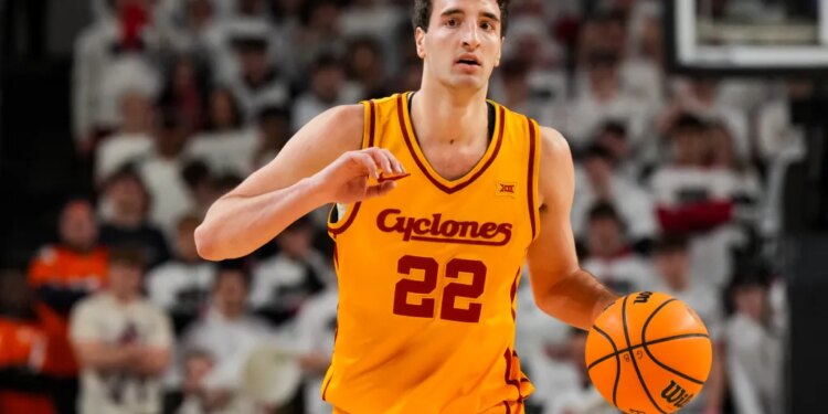 Iowa State Cyclones forward Milan Momcilovic (22) dribbles the ball.