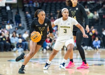 Vanderbilt Commodores guard Mikayla Blakes (1) drives around Michigan Wolverines guard Mila Holloway (3) during the first half of the Coretta Scott King Classic at the Prudential Center, Monday, Jan. 19, 2026, in Newark, NJ.
