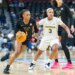 Vanderbilt Commodores guard Mikayla Blakes (1) drives around Michigan Wolverines guard Mila Holloway (3) during the first half of the Coretta Scott King Classic at the Prudential Center, Monday, Jan. 19, 2026, in Newark, NJ.
