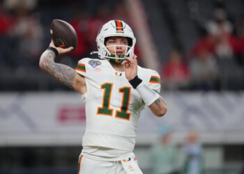 Miami quarterback Carson Beck works out prior to the Cotton Bowl.