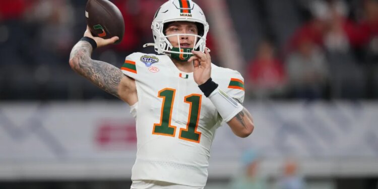 Miami quarterback Carson Beck works out prior to the Cotton Bowl.
