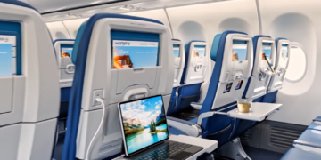 Illustration of the reconfigured cabin of a WestJet aircraft with new seats, entertainment screens, and personal device holders.
