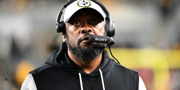 A Pittsburgh Steelers coach watches the AFC Wild Card game against the Houston Texans.