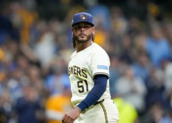 Milwaukee Brewers pitcher Freddy Peralta walks to the dugout after the top of the fifth inning in Game 2 of baseball's National League Championship Series against the Los Angeles Dodgers, Tuesday, Oct. 14, 2025, in Milwaukee.