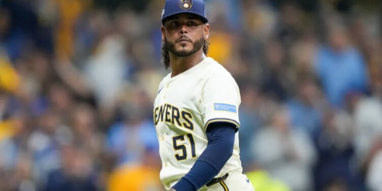 Milwaukee Brewers pitcher Freddy Peralta walks to the dugout after the top of the fifth inning in Game 2 of baseball's National League Championship Series against the Los Angeles Dodgers, Tuesday, Oct. 14, 2025, in Milwaukee.