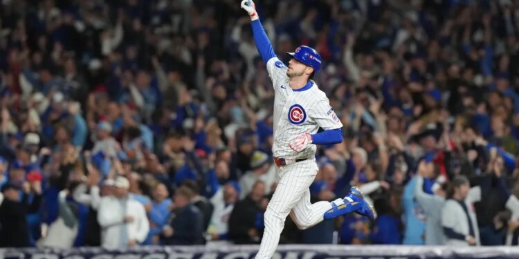 Chicago Cubs' Kyle Tucker (30) points to the sky after hitting a solo home run.