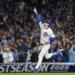 Chicago Cubs' Kyle Tucker (30) points to the sky after hitting a solo home run.