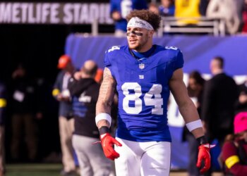 Tight end Theo Johnson #84 of the New York Giants on the field during warm-ups at MetLife Stadium.