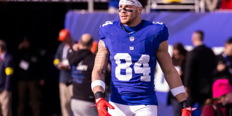 Tight end Theo Johnson #84 of the New York Giants on the field during warm-ups at MetLife Stadium.