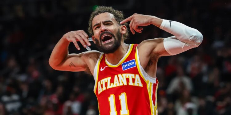 Atlanta Hawks guard Trae Young (11) yells at the referee during the game against the Chicago Bulls during the third quarter at State Farm Arena.