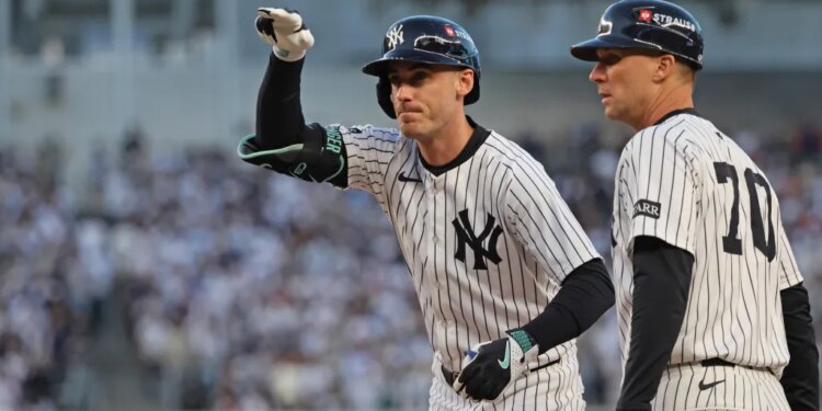 Cody Bellinger #35 of the New York Yankees reacts after hitting a single during the first inning.