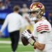 San Francisco 49ers quarterback Mac Jones (10) warms up before the game against the Indianapolis Colts at Lucas Oil Stadium.