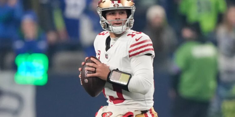 San Francisco 49ers quarterback Brock Purdy looks to throw during an NFL football playoff game.
