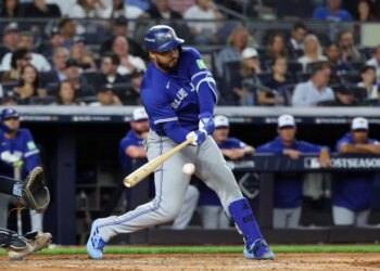 Anthony Santander hitting a baseball during the 2025 ALDS.