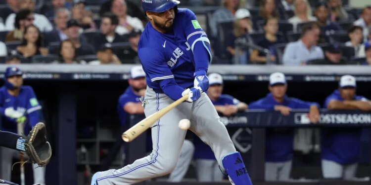 Anthony Santander hitting a baseball during the 2025 ALDS.