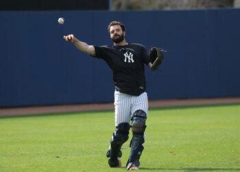 New York Yankees catcher Austin Wells throwing a ball during spring training.