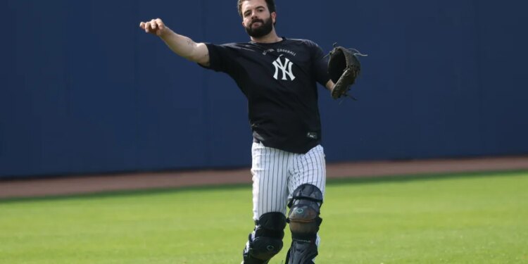 New York Yankees catcher Austin Wells throwing a ball during spring training.