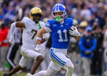 BYU wide receiver Parker Kingston (11) runs the ball in for a touchdown during the second half an NCAA college football game against UCF, Nov. 29, 2025, in Provo, Utah.
