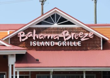 The Bahama Breeze Island Grille sign on the front of the restaurant building.