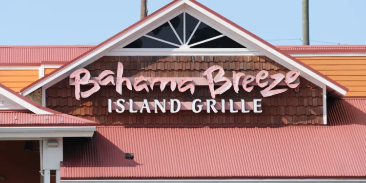 The Bahama Breeze Island Grille sign on the front of the restaurant building.