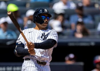 New York Yankees outfielder Trent Grisham (12) hits a solo home run.