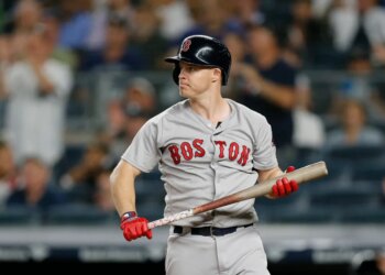 Brock Holt of the Boston Red Sox reacts after striking out.