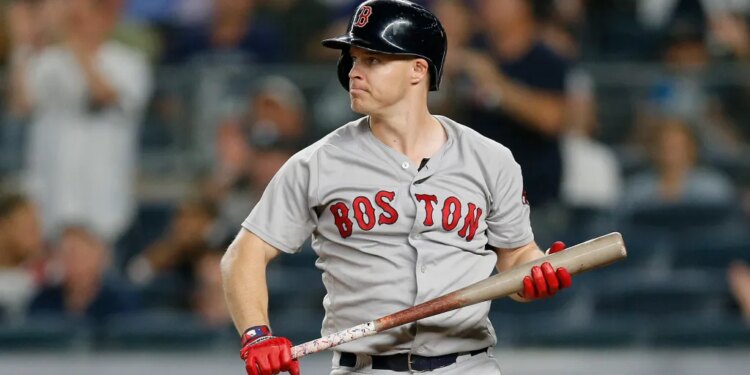 Brock Holt of the Boston Red Sox reacts after striking out.