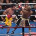 Manny Pacquiao punching Floyd Mayweather Jr. during their Welterweight Championship fight.