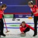 Canada's arah Wilkes, Rachel Homan and Emma Miskew in action during the women's curling round robin session against Switzerland at the 2026 Winter Olympics, in Cortina d'Ampezzo, Italy, Saturday, Feb. 14, 2026.