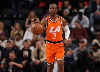 Chris Paul bringing the ball up court against the Dallas Mavericks.