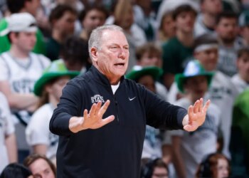 Michigan State coach Tom Izzo giving instructions during an NCAA basketball game.