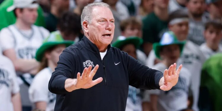 Michigan State coach Tom Izzo giving instructions during an NCAA basketball game.