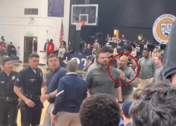 Derek Fisher arguing with Notre Dame's coach during a high school basketball game.