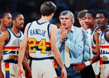 Former Denver Nuggets head coach Doug Moe speaks to his team during a timeout.