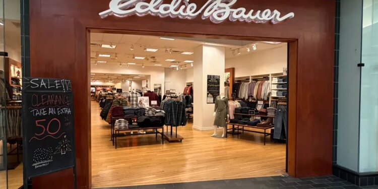 Entrance to an Eddie Bauer store with a "CLEARANCE SALE" sign.