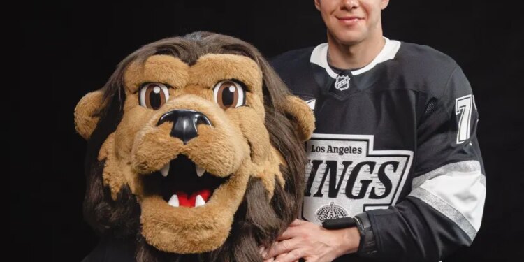 Artemi Panarin gifts a Rolex watch to the LA Kings mascot.