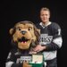 Artemi Panarin gifts a Rolex watch to the LA Kings mascot.
