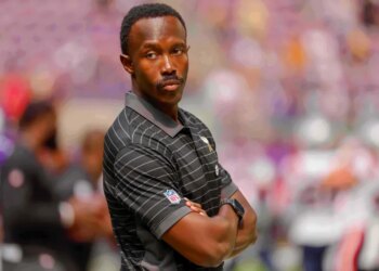 Minnesota Vikings general manager Kwesi Adofo-Mensah with arms crossed.