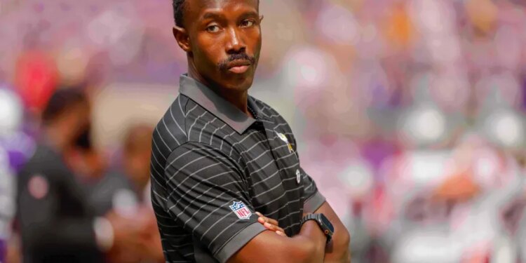 Minnesota Vikings general manager Kwesi Adofo-Mensah with arms crossed.