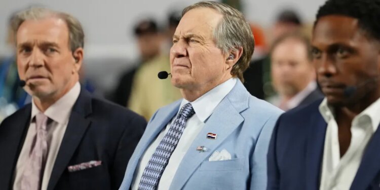 TV analyst Bill Belichick watches the game.