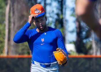 New York Mets Pitcher Freddy Peralta walks from the field during Spring Training.
