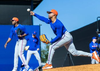 New York Mets pitcher Freddy Peralta throws a bullpen session during Spring Training.